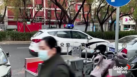 Beijing residents refuse building lockdown, COVID-19 testing