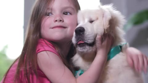 Cute girl hugging her lovely dog