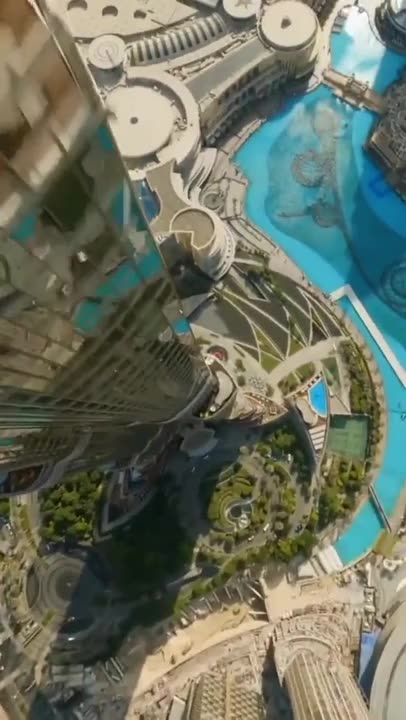 See Burj Khalifa from the top flying down! #amazingshot #feverishlyhigh #reality