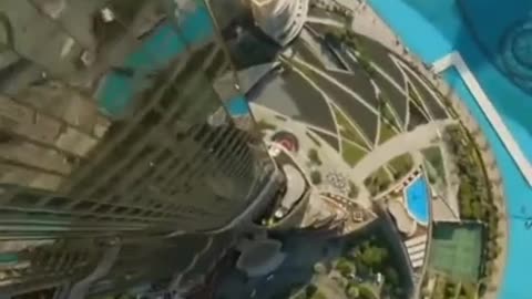 See Burj Khalifa from the top flying down! #amazingshot #feverishlyhigh #reality