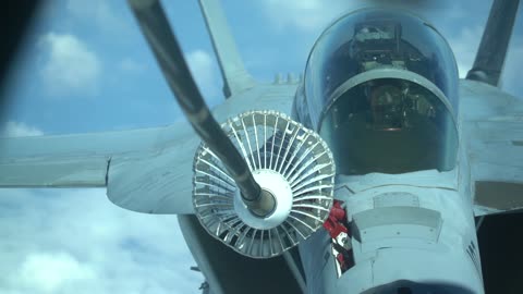 KC-10 Stratotanker refuels F/A-18 Hornet