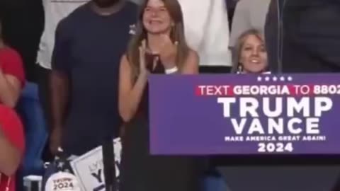 BLack supporter gifts Trump Portrait of him being shot at Rally