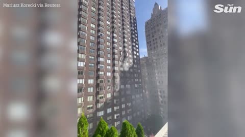 NYC firefighters rescue woman dangling from window during apartment blaze