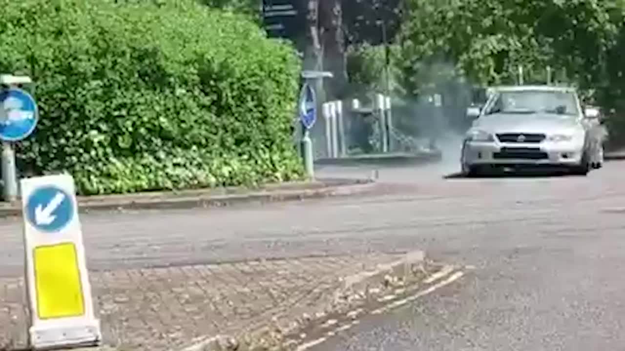 Man caught on camera doing doughnuts the wrong way around roundabout