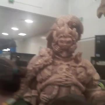 Video selfie with Orange Goddess figurine.