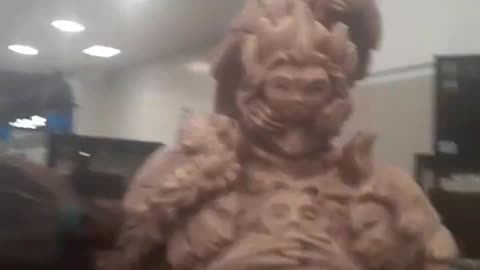 Video selfie with Orange Goddess figurine.