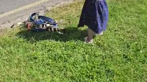 Baby girl waits for her father every day with his truck to hug and help him.
