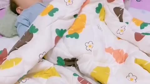 Puppy kisses baby and takes care of him