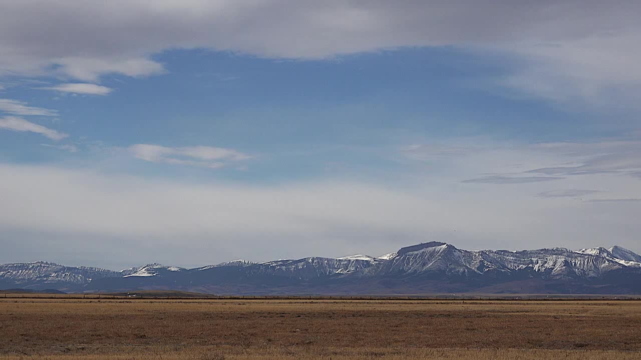 Montana view of distant Rockies under cloud