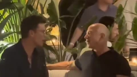 Jeff Bezos and Tom Brady casually talking business