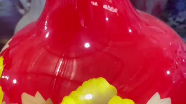 Yellow and white flower red bottom clay pot