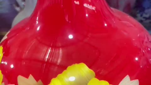 Yellow and white flower red bottom clay pot