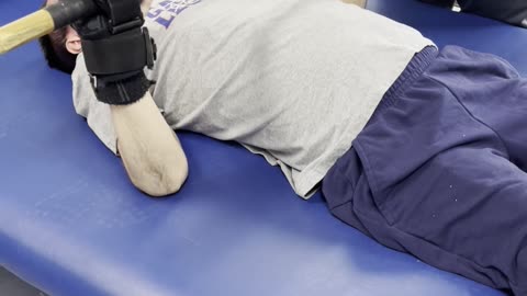 Paralyzed man doing skull crushers on his own