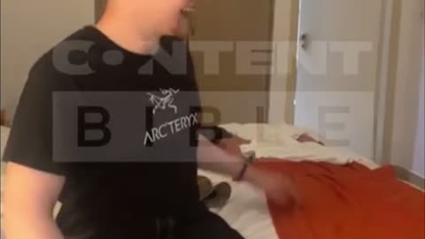 Man comes out of hotel bathroom surprising best friend on holiday