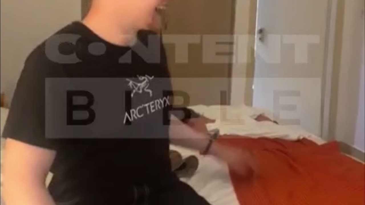 Man comes out of hotel bathroom surprising best friend on holiday