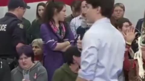 Trudeau physically removes and arrests town hall audience members when they stand up to him.