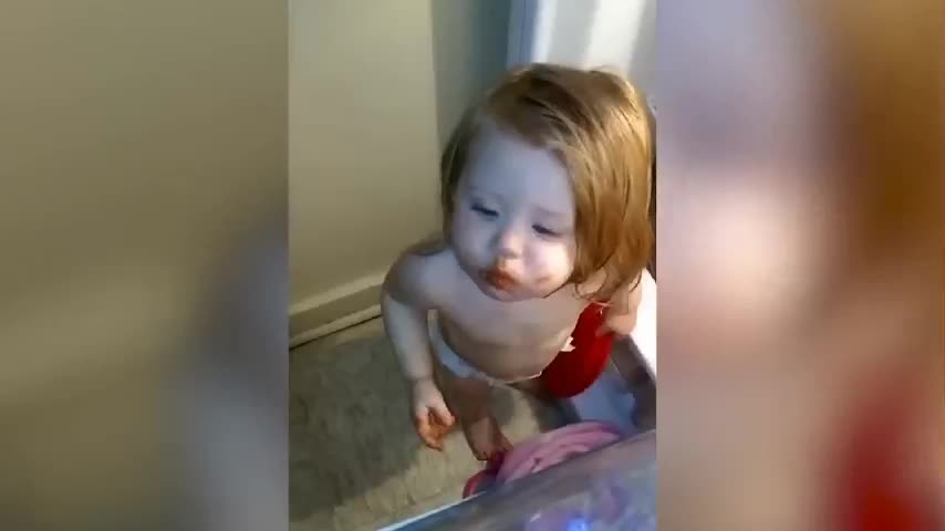funny baby caught in the refrigerator