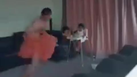 Father dance infront of baby