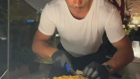 Saltbae Cutting Tomahawk Steak at Nusret Steakhouse Mykonos