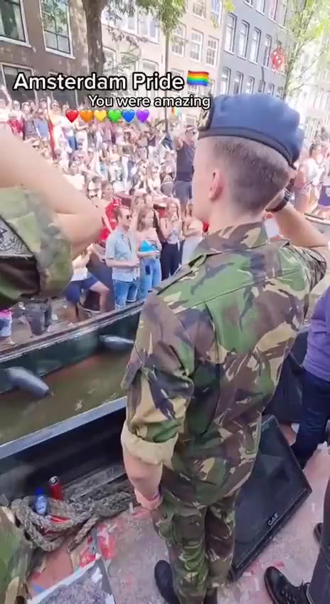 Dutch military, who defeated the Dutch farmers, salute the Dutch lgbt