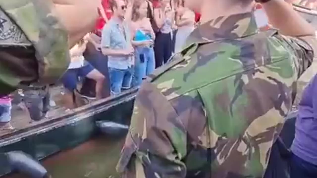 Dutch military, who defeated the Dutch farmers, salute the Dutch lgbt
