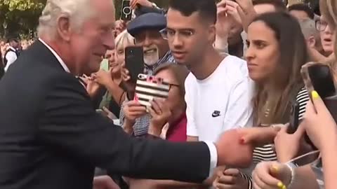 King Charles III greets crowds outside Buckingham Palace
