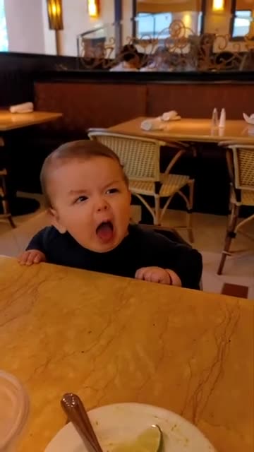 Cuite Funny baby eating lemon