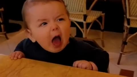Cuite Funny baby eating lemon