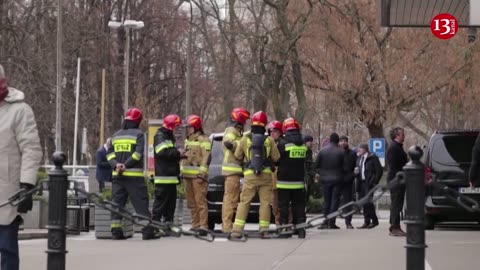 Emergency services and protesters at Biden's Warsaw hotel