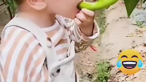 Cute baby eating chili