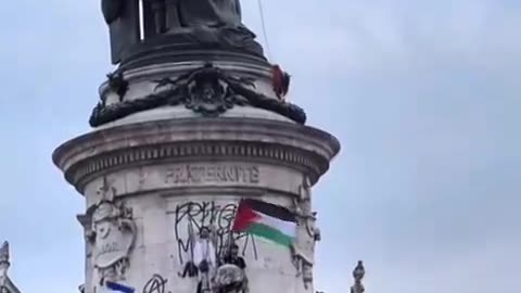 LGBTQ and Palestinian flags, communist fist, and Antifa graffiti. France is done.