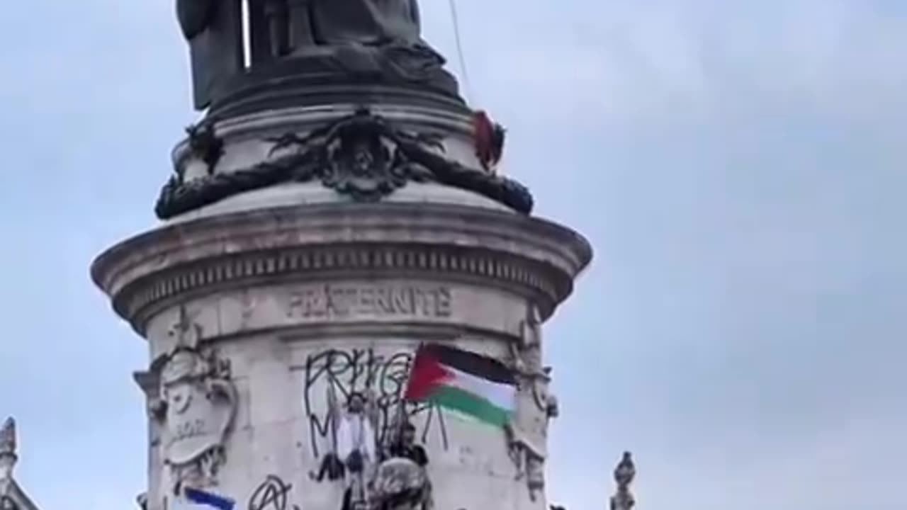 LGBTQ and Palestinian flags, communist fist, and Antifa graffiti. France is done.