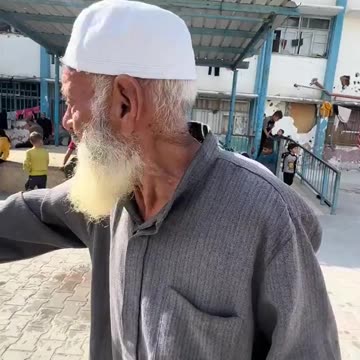 An elderly Palestinian man demands that water be provided to the children of...