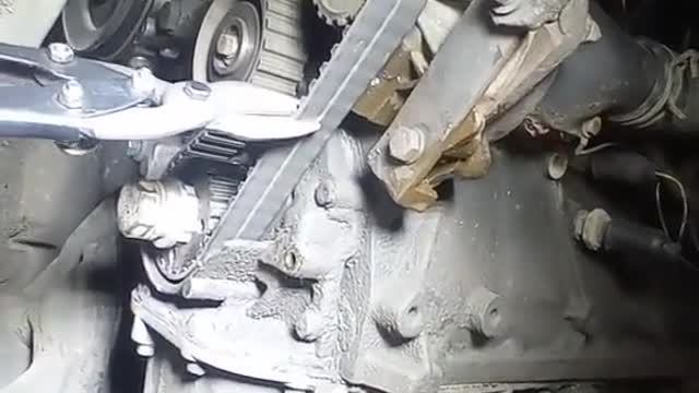 The mechanic cut off the belt.