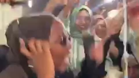 Muslim girl and friends happy dance