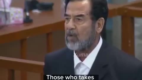 Saddam Hussein listens as his death sentence is announced on November 5, 2006.