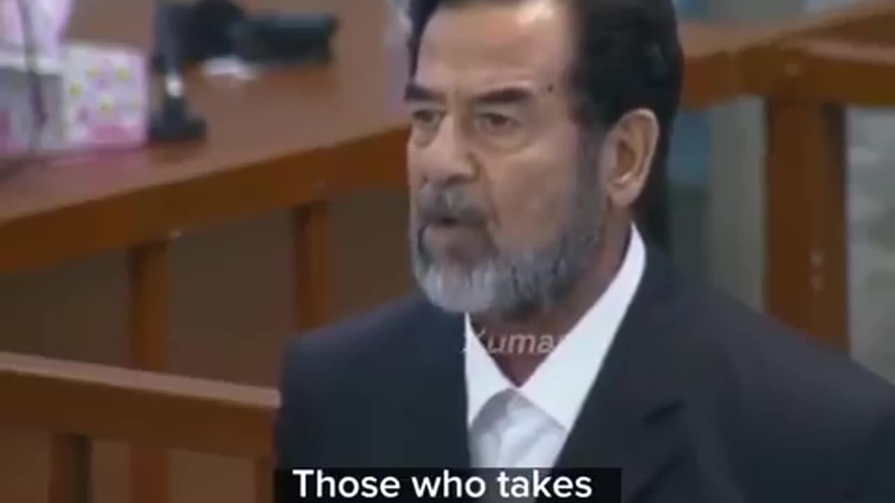 Saddam Hussein listens as his death sentence is announced on November 5, 2006.