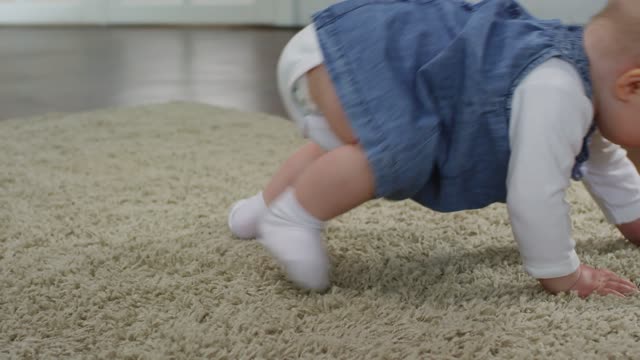 Baby learns to crawl