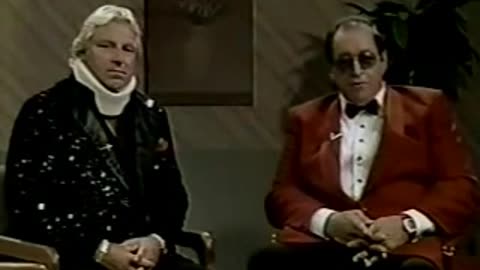 Gorilla Monsoon's Doctor examines Bobby Heenan's neck.