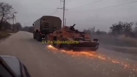 KamAZ drags its booty - already burned Ukrainian BRDM-2
