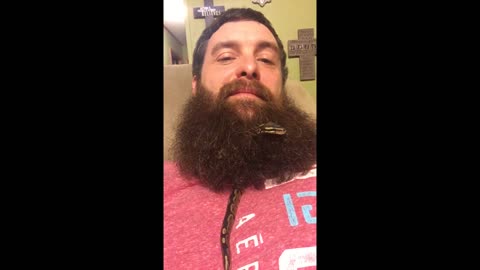 Snake slithers through man's beard