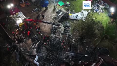 Families of Brazilian plane crash victims gather in Sao Paulo as experts work to identify the dead