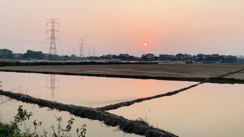 Sunset over rice paddies - Vietnam.