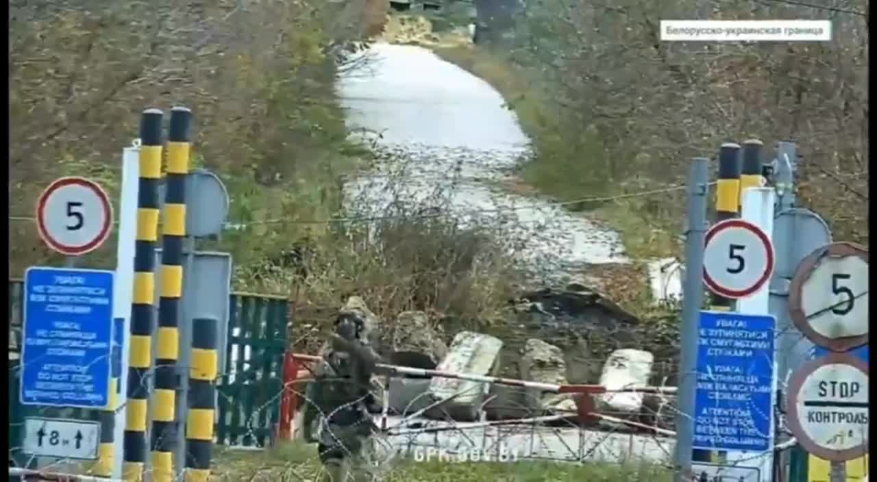 Ukraine soldier makes throat slitting gesture towards Belarus border guards