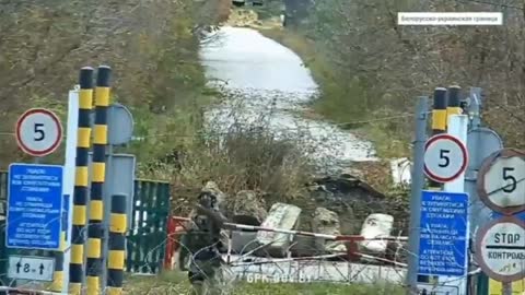 Ukraine soldier makes throat slitting gesture towards Belarus border guards