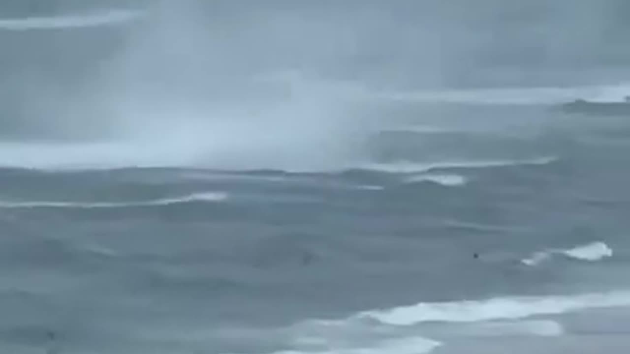 Footage Captures Waterspout Ripping Through Crowded Beach