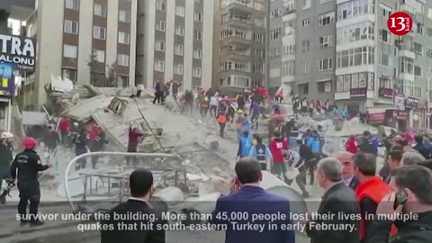 Quake-damaged building collapses trapping passersby