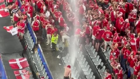 Danish Football Fans Dance In the Rain