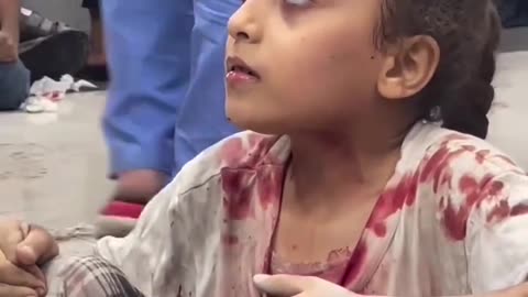 This child, trembling, waits her turn to receive treatment