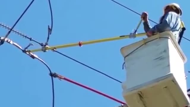 Cutting the wire of a high-voltage power line
